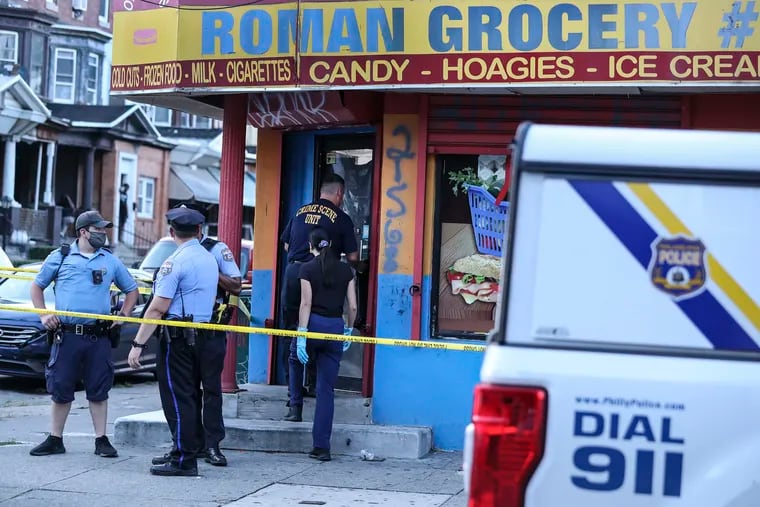 Crime scene at Roman Grocery, a corner store at 18th and W. Butler St., where a man, 28, was fatally shot multiple times in the store Monday evening by a gunman who security footage showed walked in, shot him, and fled. A woman, 53, standing nearby was hit by a bullet but expected to survive.