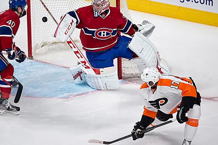 The Flyers' Wayne Simmonds scores past Canadiens goalie Carey Price as defenseman Nathan Beaulieu watches during the first period. (Paul Chiasson/The Canadian Press/AP)