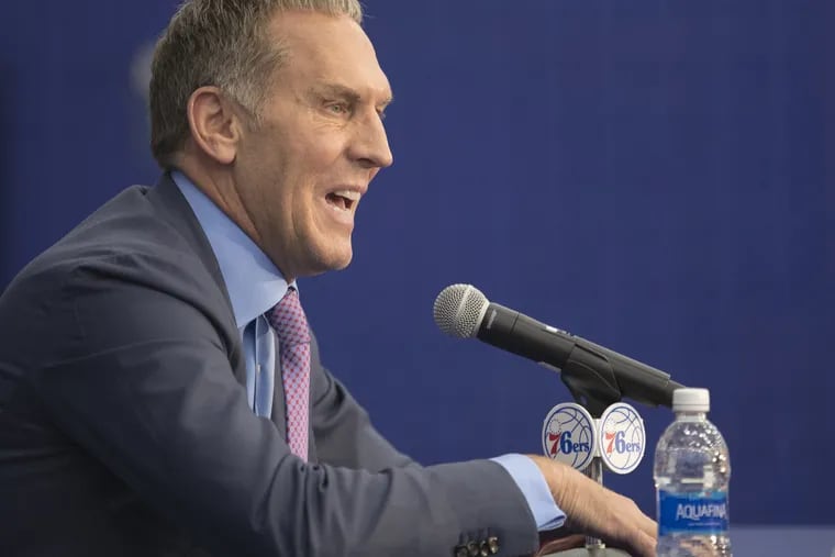Philadelphia 76ers general manager Bryan Colangelo pictured in 2017 with a bottle of wooder. 
