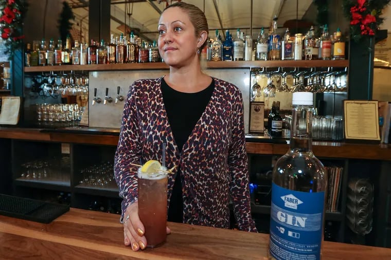 Holding a Faber Gin, Sloe Gin Fizz, Beth Fox Brown, general manager of the taproom at St. Benjamin Brewing Co. in Kensington, stocks the gamut of Pennsylvania spirits, thanks to last summer' liquor-law changes that allowed Pennsylvania limited wineries, brew pubs, and distillers to sell each other's products for on-premise consumption.