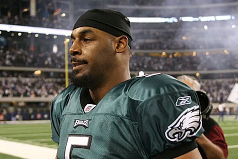 Donovan McNabb completed threw for 230 yards, one touchdown, and one interception against on Saturday. (Yong Kim/Staff Photographer)