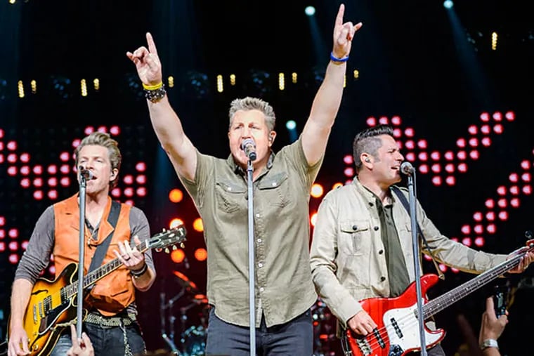 Rascal Flatts trio - singing cousins Gary LeVox and Jay Demarcus and vocalist and guitarist Joe Don Rooney - will join Nick Jonas and Maroon 5. (TODD OWYOUNG)