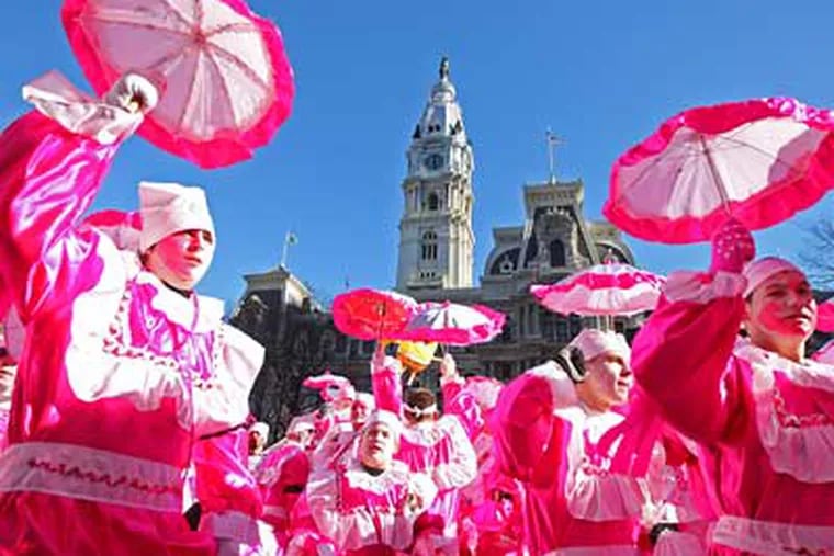 Members of the Riverfront Comics cavort in front of City Hall as they face the judges during the 2009 Mummers Parade. (Michael Bryant/Staff Photographer)