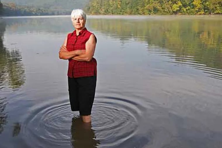 Sherry Neidichse, who bought a home about a mile form the Olin plant that is upriver from her home is very upset with the mercury content of the air and water in the Hiwassee River. (Michael Bryant/Inquirer)