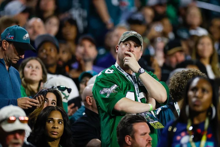 An Eagles fan possibly judging Kansas Chiefs fans. (He's actually at State Farm Stadium watching the Eagles' performance in the fourth quarter of the Super Bowl).