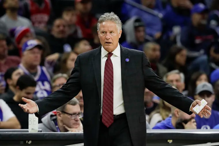 Sixers coach Brett Brown watching his team play the Charlotte Hornets on Nov. 11.