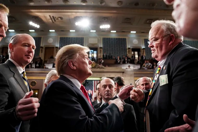 President Donald Trump takes with Rep. Billy Long (R., Mo.) after giving his State of the Union address to a joint session of Congress.