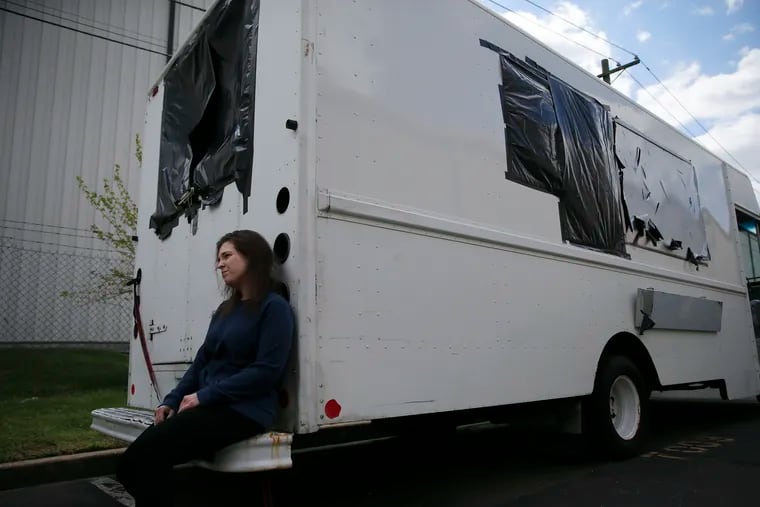 Rebecca Foxman sits on the rear of her nonoperational food truck at the Extra Space Storage in Pennsauken, New Jersey on Thursday, April 22, 2021.