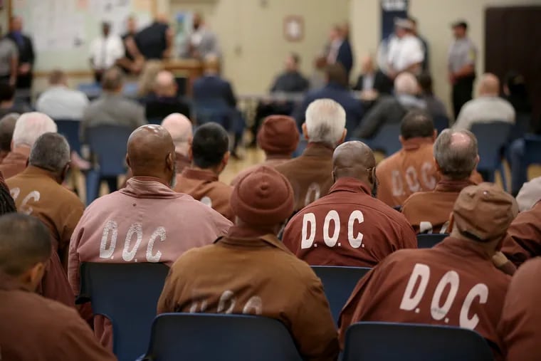 Elderly inmates listen during an information session about the commutation process at State Correctional Institution Dallas, in a 2019 file photograph.