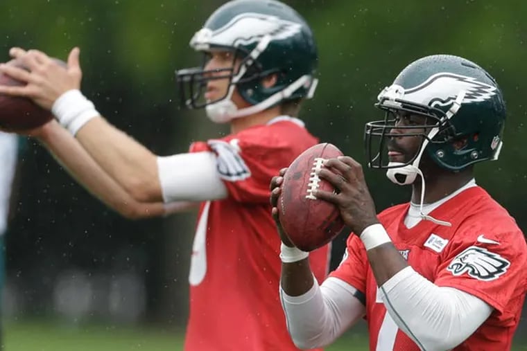 Nick Foles Michael Vick during practice at the team's NFL football training facility, Tuesday, May 28, 2013, in Philadelphia. (Matt Rourke/AP file)
