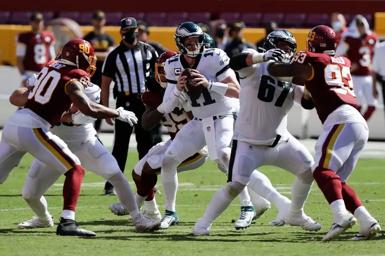 Carson Wentz completed 14 of his first 18 passes for 182 yards and two touchdowns, then struggled from that point on in the Eagles' loss at Washington.