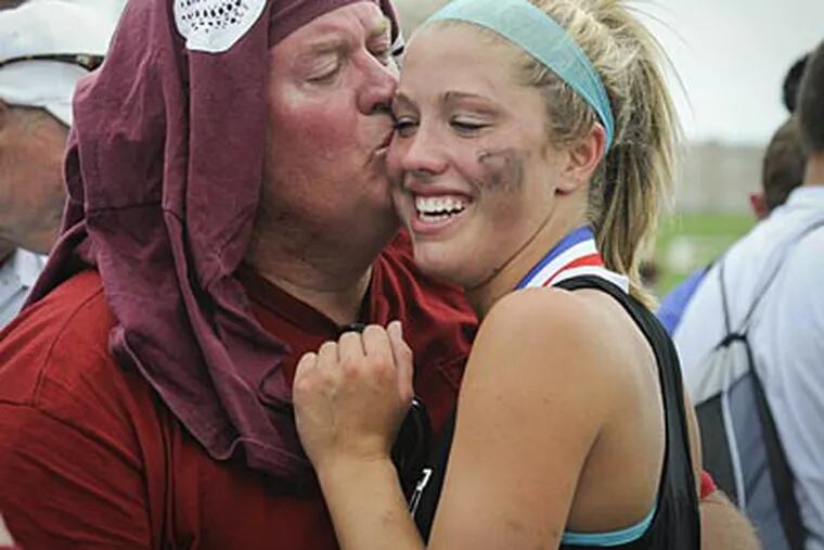 Allyson Heavens gets a kiss from her father after winning the PIAA state championship. (Ron Tarver/Staff Photographer)