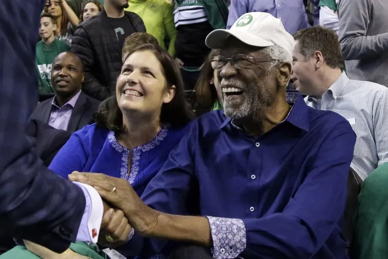 Celtics legend Bill Russell getting greeted at his seat before Game 1 against the Sixers.
