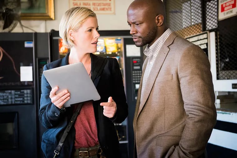 Watching the detectives: Kathleen Robertson and Taye Diggs are partners in &quot;Murder in the First.&quot;