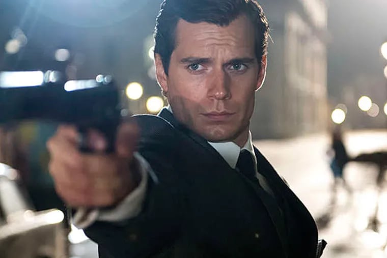 Henry Cavill portrays the droll and debonair CIA operative Napoleon Solo in the reheat of the 1960s TV show &quot;The Man From U.N.C.L.E.&quot; (DANIEL SMITH)