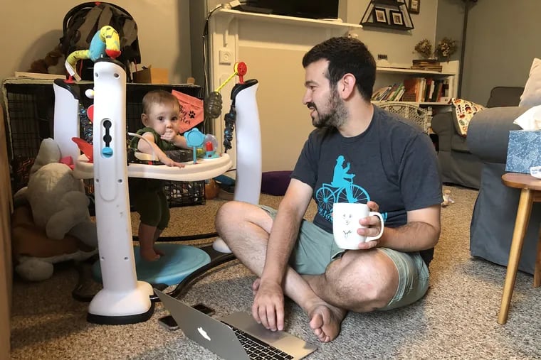 Max Weisman with his daughter, juggling work and child care.
