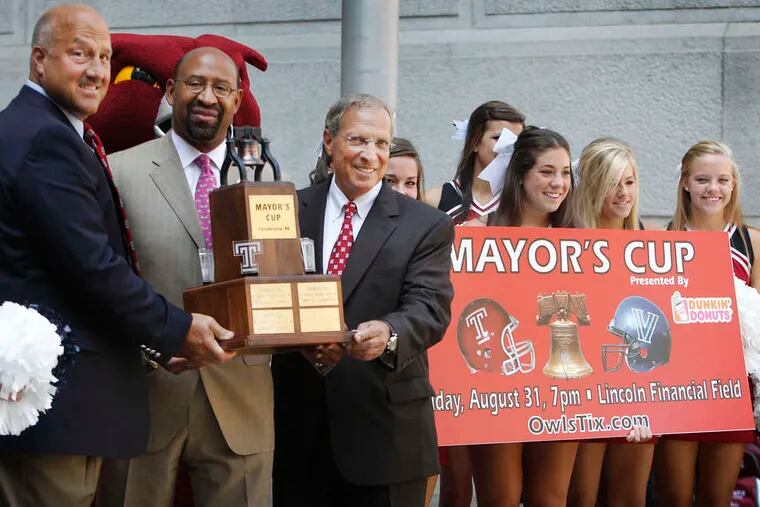 That's the cup: From left, Temple's Steve Addazio, Mayor Nutter, and Villanova's Andy Talley display the Mayor's Cup. Next Friday's game is the series' last.