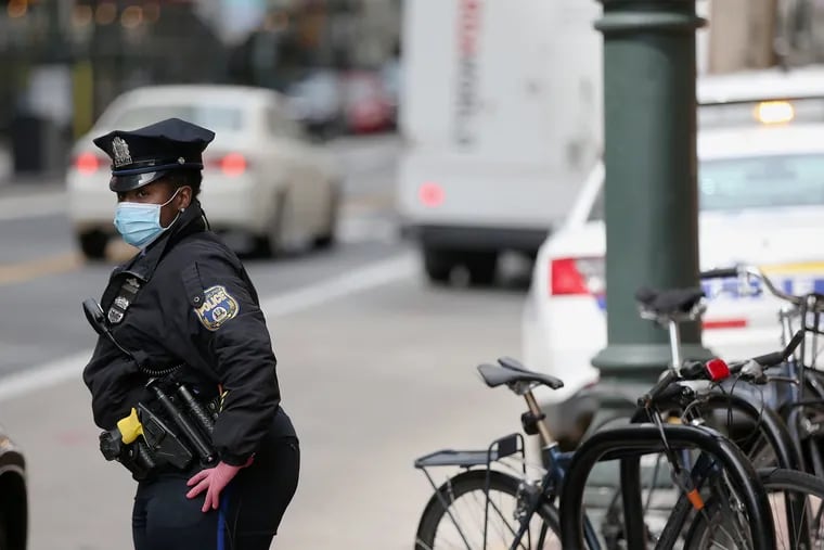 A Philadelphia police officer talking to a motorist on East Market Street in Center City on Thursday.