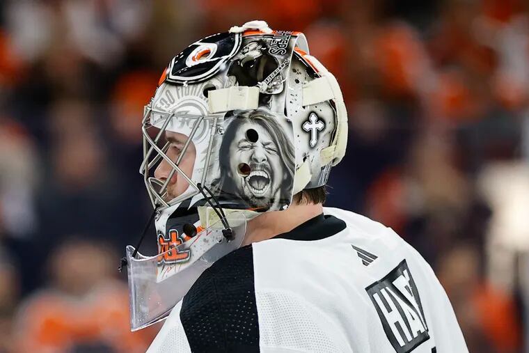 Flyers goaltender Carter Hart with an image of Foo Fighters lead singer Dave Grohl on his helmet against the Arizona Coyotes on Thursday, January 5, 2023 in Philadelphia.