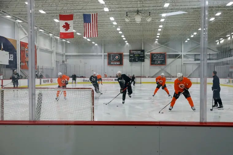 Flyers players work out during training camp at the NHL hockey team's practice facility Monday in Voorhees.