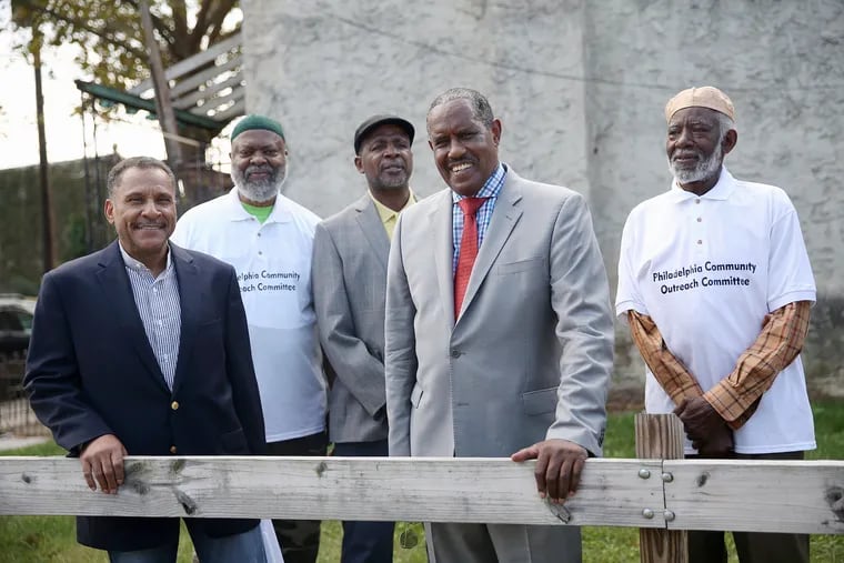 Philadelphia Community Outreach Committee members (from left) Pete Wilson, Abdul-Malik Ibrahim, Islam Sharief, Ishaq Samai, and Khabir Rashid stand for a portrait at North 43rd and Pennsgrove streets in West Philadelphia on Thursday, Sept. 26, 2019. The neighborhood was the site of the group's first cleanup effort.