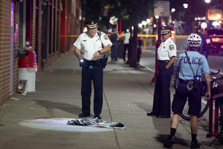 Philadelphia Police Inspector D. F. Pace at the scene of the deadly shooting on South Street on June 4.