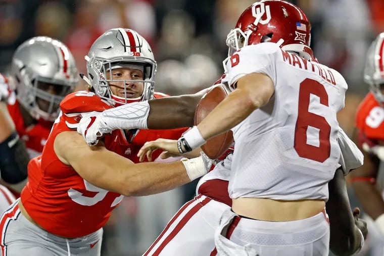 Ohio State's Nick Bosa (left), here sacking Oklahoma's Baker Mayfield in 2017, isn't expected to last long on the draft board.