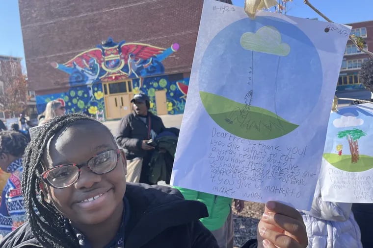 Ciani Wilson was one of a group of students at James Rhoads School in Philadelphia that hung notes on newly planted trees on the school's grounds on Thurs., Nov. 16, 2023.