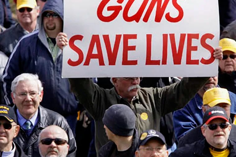 Gun owners rally at the Illinois State Capitol in Springfield, Ill., Wednesday, Mar. 11, 2009, to seek legislation that would let them carry concealed weapons. (AP Photo / Seth Perlman)