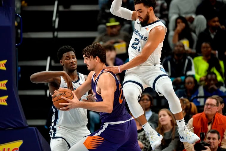 Dario Saric (middle) is averaging 9.5 points, 6.5 rebounds and 2.3 assists through six games, all starts, for the Suns.