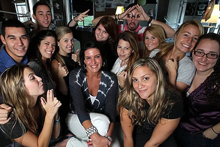 Michelle Zubizaretta, center, poses with several of her Gen-Y aged employees at her Zubi Adverstising in Coral Gables, Florida, on August 11, 2010. (Al Diaz/Miami Herald/MCT)