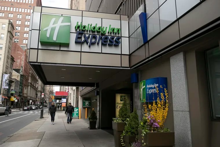 The Holiday Inn Express at 13th and Walnut in Center City is photographed on Tuesday, March 24, 2020. The city is planning to turn the hotel into Philadelphia’s first coronavirus quarantine site and use it to house homeless people who test positive for the virus, according to two people with knowledge of the plans.