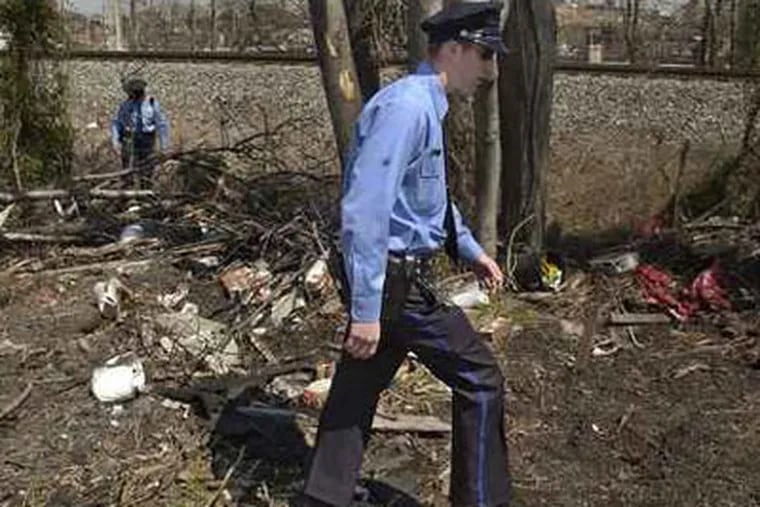 Police officer Thomas Schaffling, foreground, on the beat in 2003 searching for a missing child.  (File Photo / Jonathan Wilson)