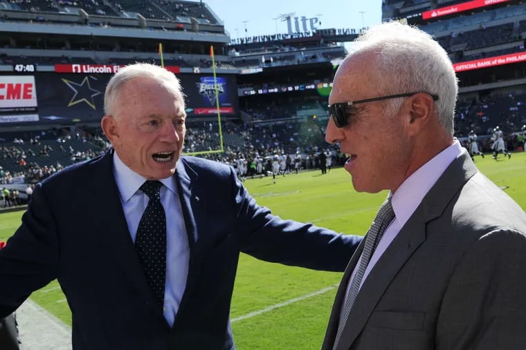 Dallas Cowboys owner Jerry Jones (left) has run his franchise's daily operations since 1996, to minimal success. For better or worse, Eagles owner Jeffrey Lurie is becoming more like him every day.