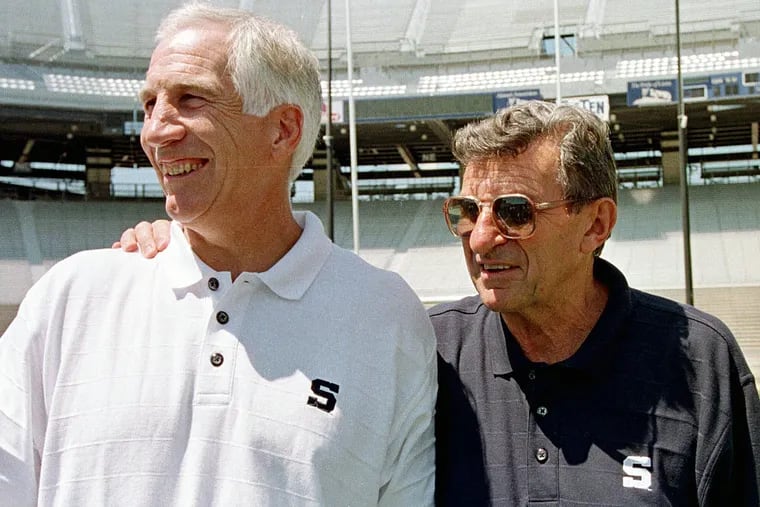 In this Aug. 6, 1999, file photo, Penn State head football coach Joe Paterno ( right) poses with his defensive coordinator Jerry Sandusky during Penn State Media Day at State College.