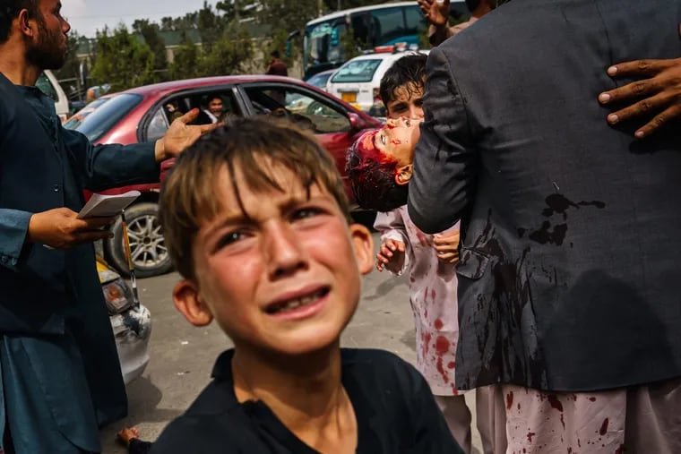 Taliban fighters used gunfire, whips, sticks, and sharp objects to maintain crowd control over thousands of Afghans who waited outside the Kabul Airport on Aug. 17, 2021.