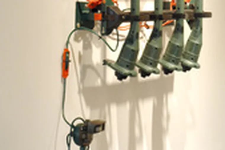 The TODT group&#0039;s &quot;Phalanx&quot;: Weed whacker-type machines affixed to the wall. The noise, when the contraption is plugged in, can empty the gallery.