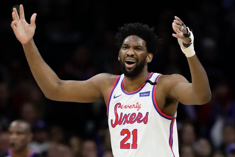 Sixers center Joel Embiid reacts after committing a first-quarter offensive foul against the Memphis Grizzlies on Friday, February 7, 2020 in Philadelphia.