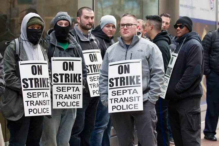 Striking SEPTA transit police officers stood outside SEPTA Headquarters at 1234 Market St. early this month.