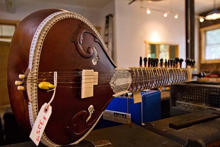 A sitar is for sale at Collingswood Music. Owner Ted Velykis said they sell one just about every year. ( DAVID M WARREN / Staff Photographer )