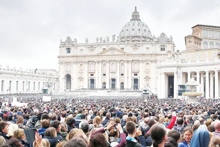 A crowd gathers on Sunday at noon for the Angelus prayer when the Pope speaks from his window overlooking St. Peter's Square in Vatican City on March 23, 2014.  ( DAVID MAIALETTI / Staff Photographer )