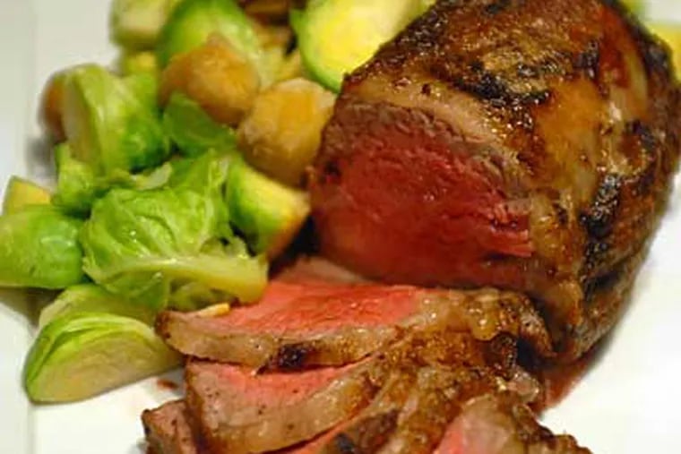 Affordable and festive, a sirloin roast with brussels sprouts and chestnuts prepared by Barclay Prime chef Daniel Kremin.