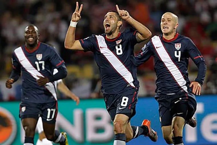 Clint Dempsey celebrates after tying the score in the United States' game against England. (AP Photo/Elise Amendola)