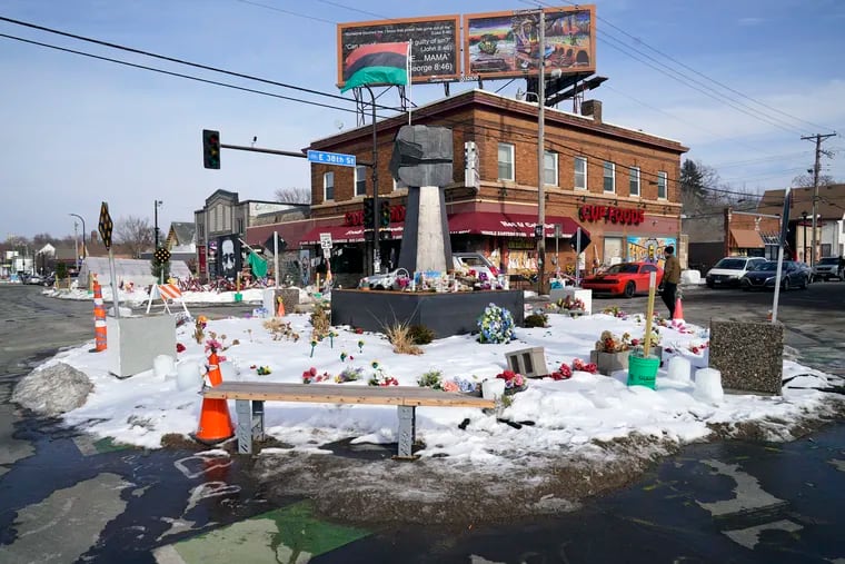 George Floyd Square is shown in Minneapolis. Ten months after police officers brushed off George Floyd's moans for help on the street outside a south Minneapolis grocery, the square remains a makeshift memorial for Floyd, who died at the hand of police making an arrest. .