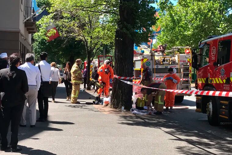 Hazmat and fire crews work outside the Indian and French Consulate in Melbourne, Australia Wednesday, Jan. 9, 2019. At least seven international consulates were evacuated in Melbourne, Australia, on Wednesday after reports that multiple suspicious packages had been sent to them. (Kaitlyn Offer/AAP Image via AP)