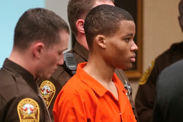 Lee Boyd Malvo listens to court proceedings during the trial of fellow sniper suspect John Allen Muhammad in 2003.