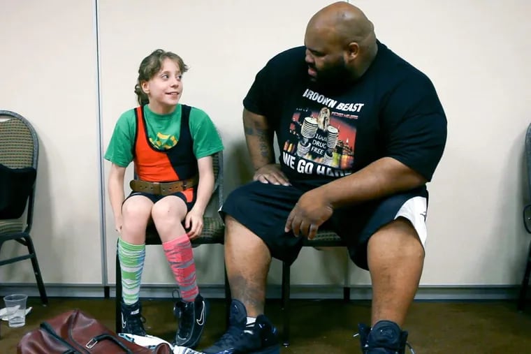Naomi Kutin and a fellow powerlifter at a competition