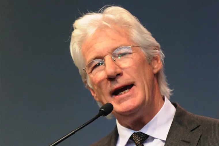 Richard Gere, actor and Tibetan rights activist, and friend of the Dalai Lama, gives a testimonial to the spiritual leader during the Libery Medal ceremony at the National Constitution Center October 26, 2015.