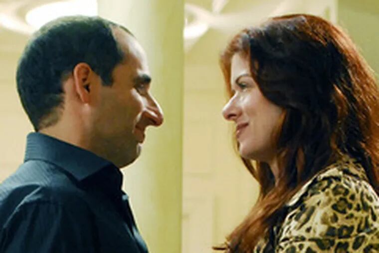 Debra Messing is the wife, Peter Jacobson the showbiz-exec husband.