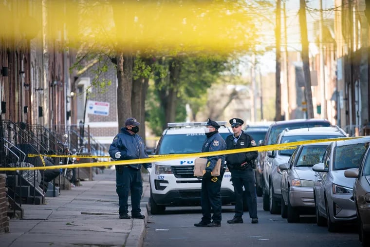 Police investigate a police involved shooting on the 1500 block of South Bailey Street, in Philadelphia, April 10, 2020.